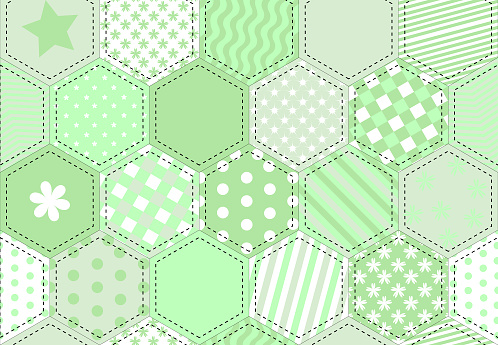 A vector illustration of a patchwork fabric in shades of green