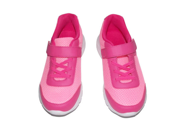 istock Pink youth sneakers Isolated on a white background. 1410408297