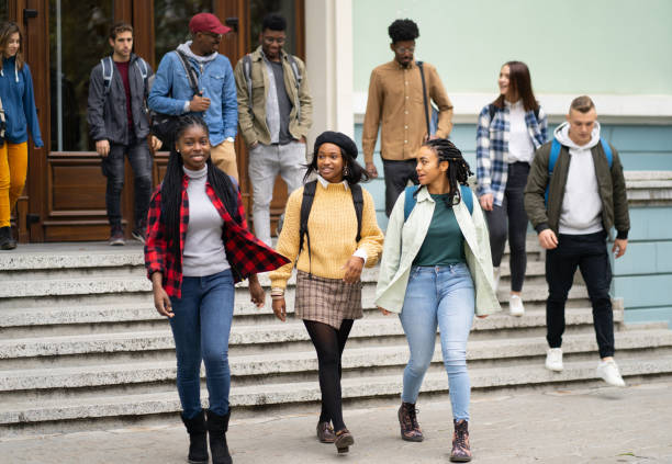 istock A multiethnic group of students going out of the University 1410409412