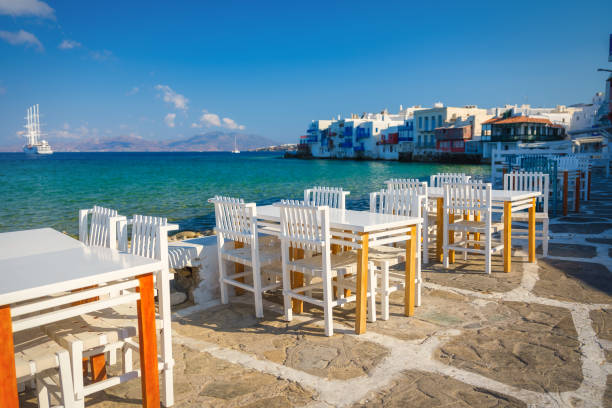 A restaurant overlooking Little Venice, Mykonos Island, Greece. Lunch and dinner overlooking the sea. Photo as wallpaper. stock photo