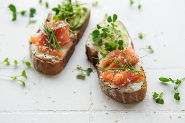istock Sandwiches with salted salmon,  avocado and microgreens. 1410411897