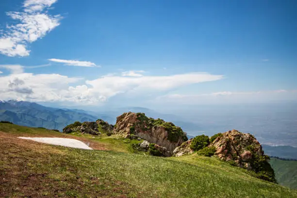 Photo of Top of the mountain 3 brothers, a popular trekking place near Almaty, copy space