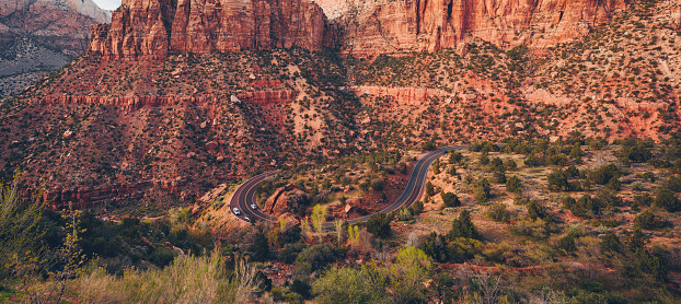 The road inside the Zion National Park is winding and running inside the canyon of this beautiful national park in Utah, United States.