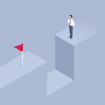 isometric vector illustration on a gray background, a man in business clothes pensively stands in front of an abyss looking at the flag on the opposite side, an obstacle to the goal