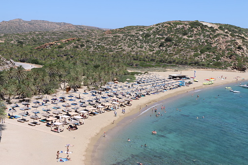 A beautiful beach in the northeast of Crete with typical palm trees