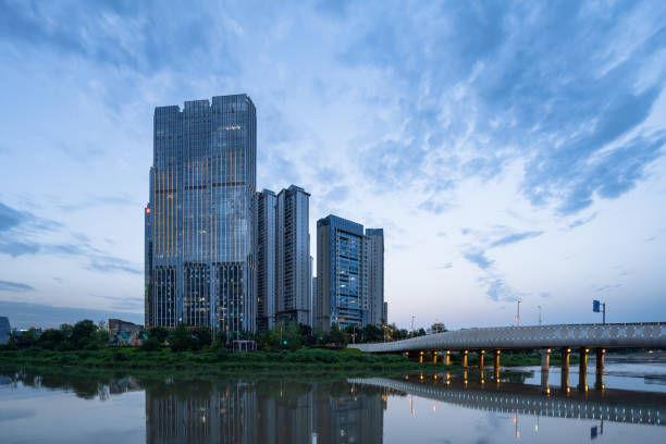 istock Riverside modern city at dusk 1410418878