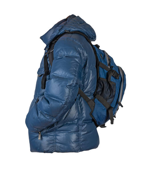 istock black backpack dressed in a red jacket isolated on a white background. 1410420542