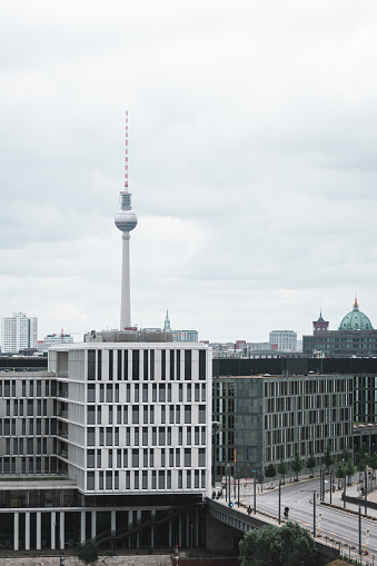 Berlin skyline with view to the Berliner Fernsehturm (translated: Berlin Television Tower) during an overcast day in Berlin, Germany.
