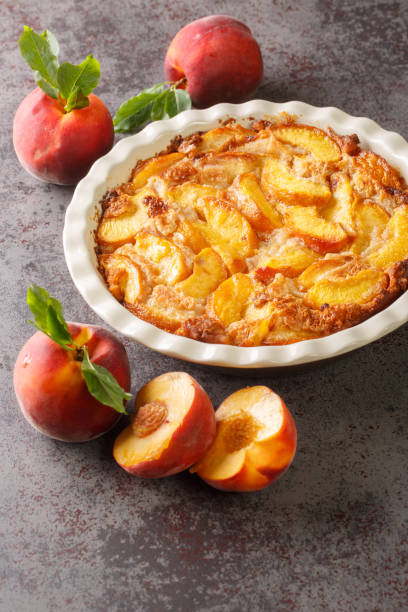 istock Homemade peach cobbler crumble in baking dish. Vertical 1410425672