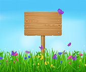 istock Wooden signboard on summer meadow 1410425734