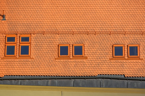 Roof of an historic house in center of Telc city with an roof windows. Photo from above.