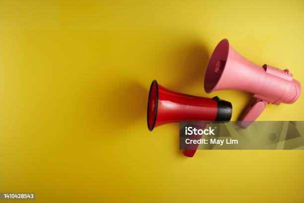 Megaphone Against Yellow Background Stock Photo - Download Image Now - Voice, Advertisement, Alertness