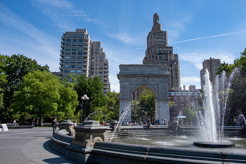 Manhattan, New York City - June 5, 2022. People strolling in Washington Square Park during a sunday morning