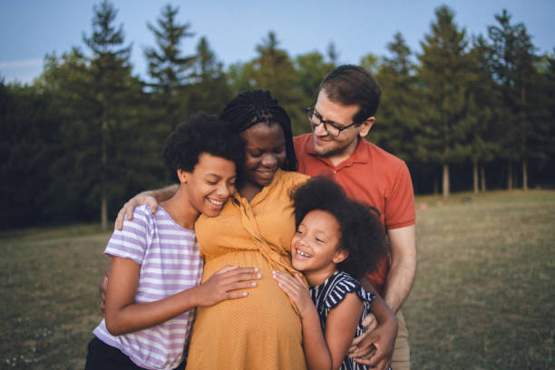 istock Multiracial family going for a walk in the public park 1410429620