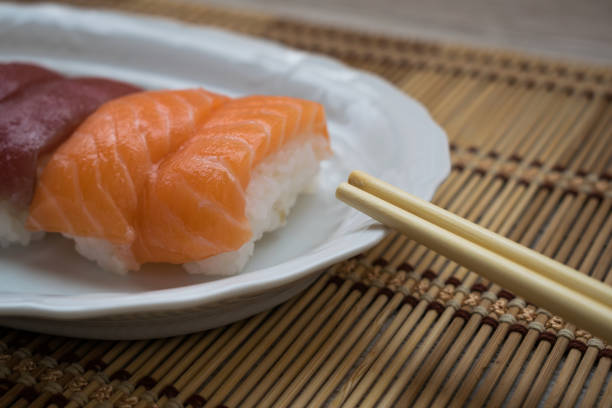 Close-up of sushi with chopsticks