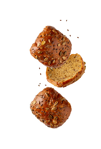 whole grain bread slices flying on white background, copy space