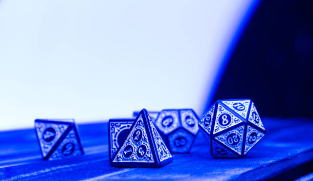 istock RPG dice illuminated with colored light, light painting style photo, selective focus. 1410433529