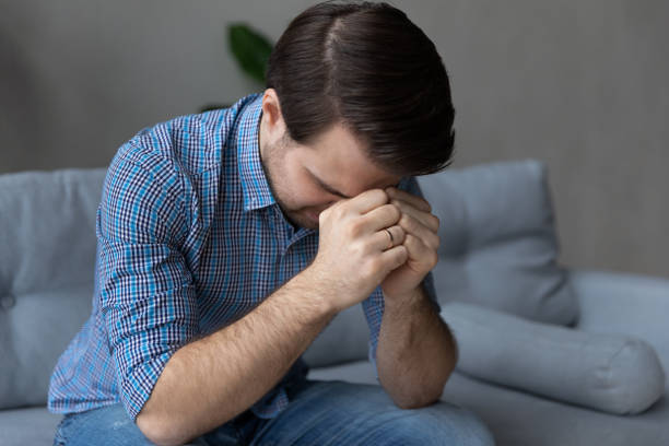 istock Stressed unhappy young man suffering from depression. 1410433633