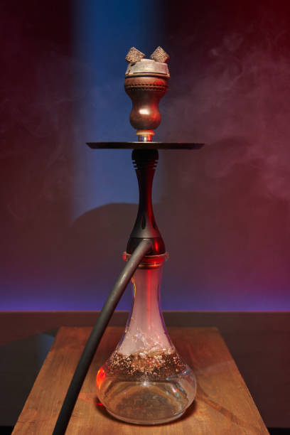 istock beautiful hookah with a transparent flask in white smoke in multi-colored light 1410433774