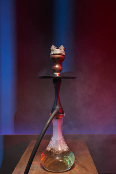 istock beautiful hookah with white smoke and transparent flask 1410433776