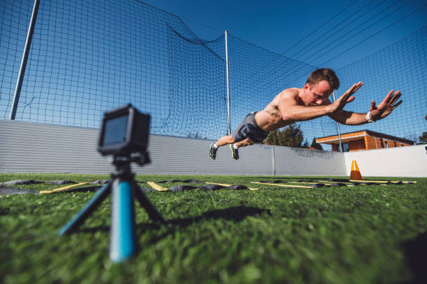 Man filiming himself with a gopro while doing jumping pushups