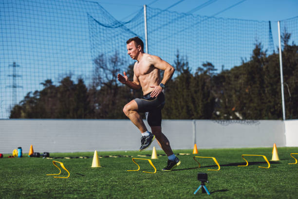 istock Shirtless caucasian athlete sprinting over obstacles 1410433974