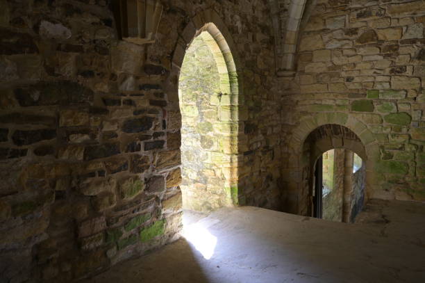 istock Inside of a Medieval Abbey on a sunlit summer morning. 1410436056