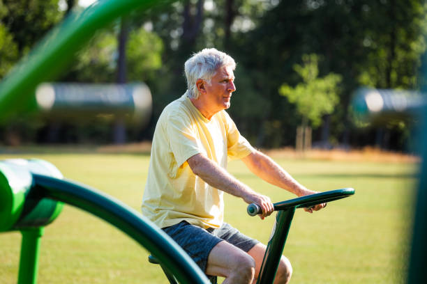 istock Senior man working out using gym machines outdoors in park 1410436168