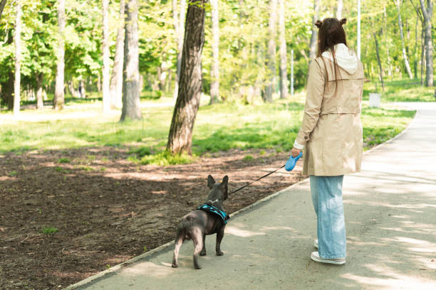 istock Young woman with dog 1410436218