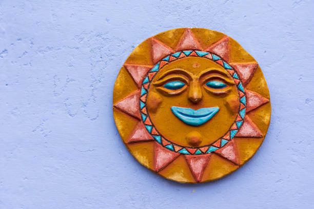istock Wall decoration representing the sun on a pastel blue background 1410438713