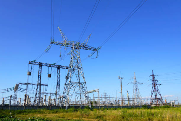 Image of high voltage substation Image of high voltage substation. Distribution electrical power. Silhouettes of pylons and towers. public utility stock pictures, royalty-free photos & images