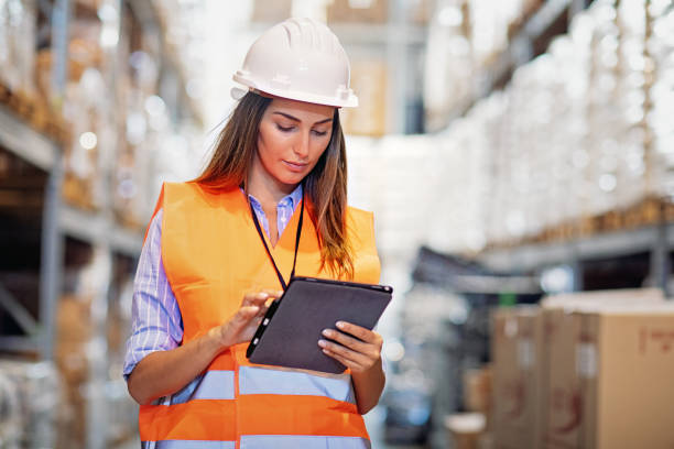 Portrait of warehouse manager working in a warehouse stock photo