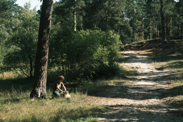 istock Woman is sitting under the tree in nature park 1410442869