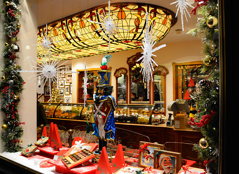 Brussels, Belgium - December 29, 2021: Belgian Chocolate Shop in the famous Galeries Royales Saint-Hubert in Brussels, Belgium.