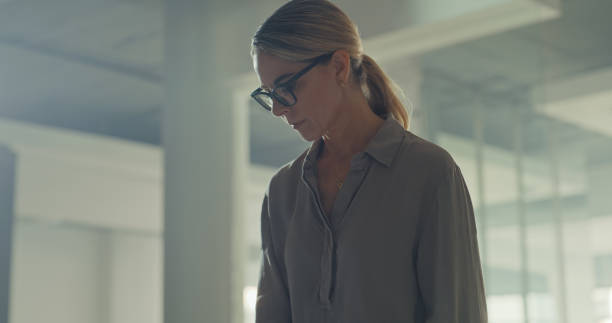 istock A serious business woman focused on her work in a modern office with copy space. A dedicated female architect planning and working alone at her workplace. Corporate lady finishing urgent project 1410446012
