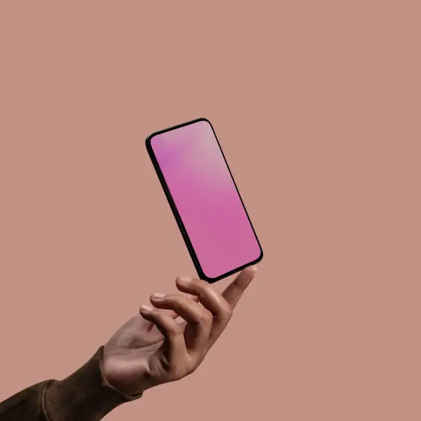 Photo of Mobile Phone Mockup Image. Screen as Empty. Hand levitating a Blank Display Smartphone. Clean and Minimal Styles