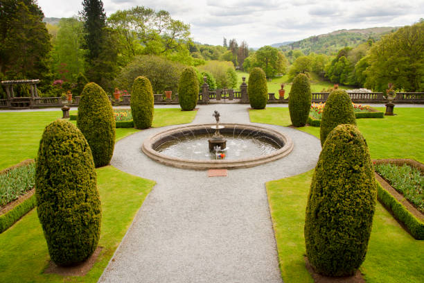 The English Lake District is bursting with magnificent country views, beautiful lakes, fells,mountains, waterfalls and gardens.This is a view of the beautiful ornamental gardens that grace the exterior of Rydal Hall Mansion, on the edge of Rydal village.Just two miles from Ambleside, the gardens stretch to 34 acres and are well worth  a  visit.