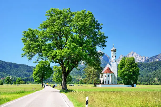 St. Coleman's Church with mountains in background, Schwangau municipality, Bavaria, Germany