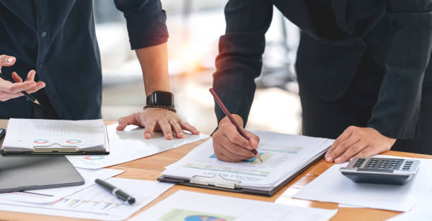 istock Business People Consulting meeting analyzing and brainstorming, using graph chart, finance investment concept. 1410453487