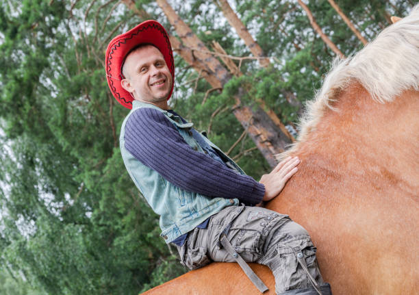 Mid adult man riding a horse