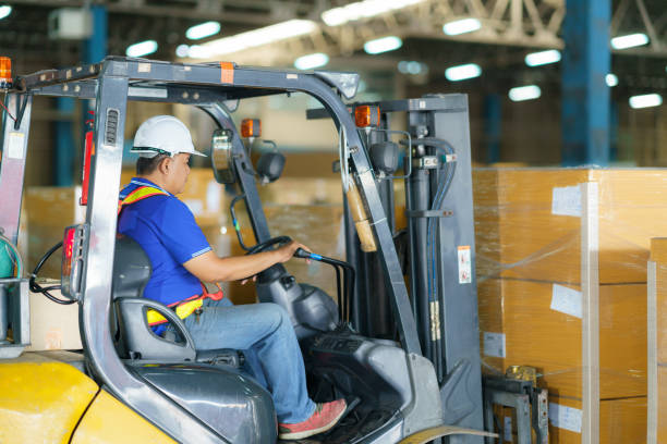 istock Forklift are loading into cargo containers at warehouses, ports, freight forwarding, cargo supply chains, cargo transportation, warehouse industry, logistics. 1410456646