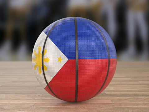 Basketball ball Philippines flag on a wooden floor. 3d illustration.