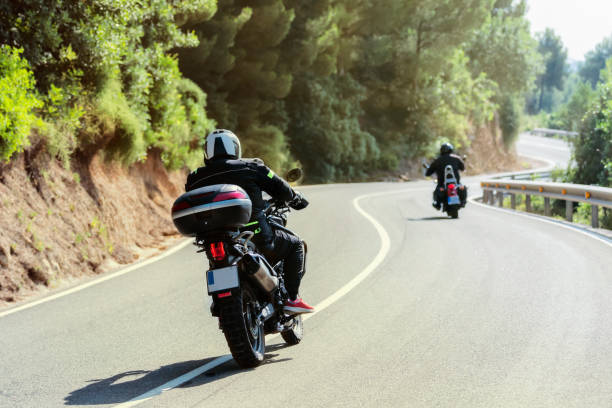 istock Well geared bikers driving along a curvy road 1410469109