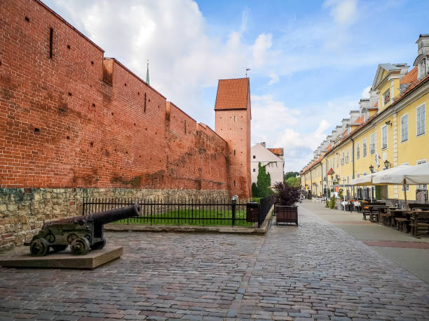 Riga, Latvia - August 7, 2019: Tourists walk along city old fortifications on a sunny day