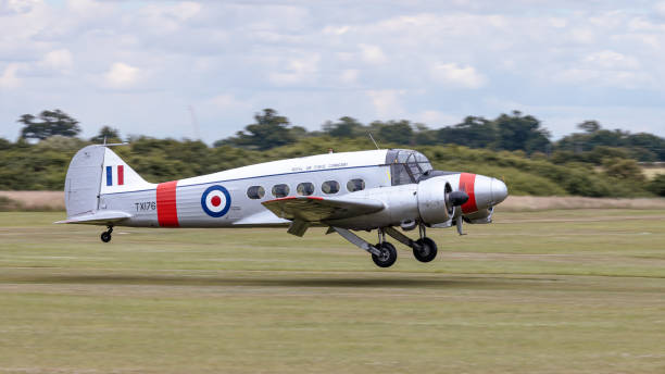 Old Warden, UK - 3rd July 2022: An iconic vintage Avro Anson aircraft seen in operation at Old Warden Airfield in Bedfordshire in the UK. The aircraft was in action at the Fly Navy air display and is in full flying condition despite its age.