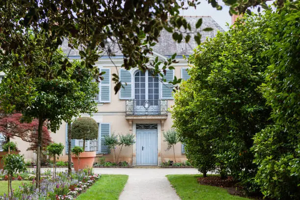 Photo of Facade of a classic architecture and garden in France