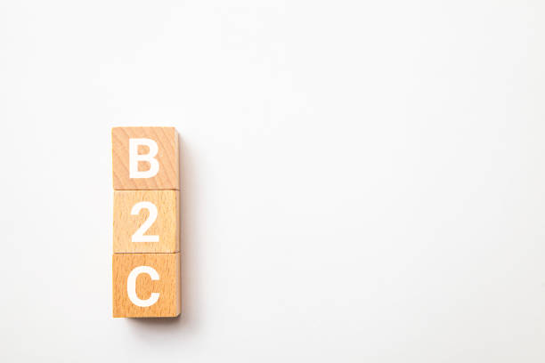 istock B2C. Transactions between businesses and general consumers. Business to Customer. B2C letters drawn on a wooden block. 1410474979