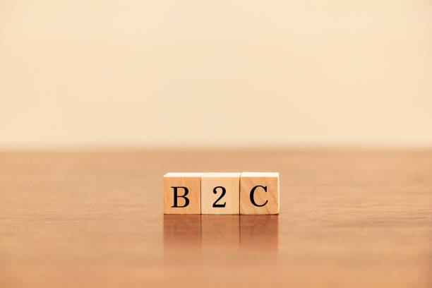istock B2C. Transactions between businesses and general consumers. Business to Customer. B2C letters drawn on a wooden block. 1410476071