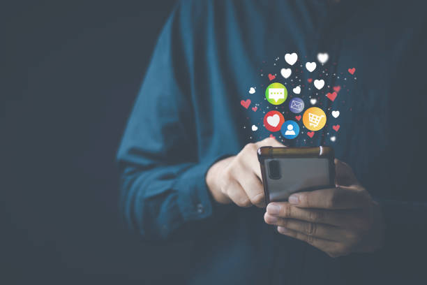 istock Social media technology concept, man hand using smartphone Login to the online network Use social media to do business and marketing payment from home through the Internet. 1410476255