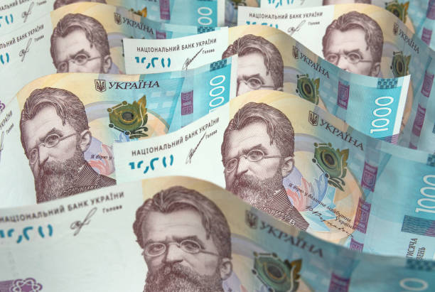 Banknotes of one thousand Ukrainian hryvnia close up The one thousand UIkrainian hryvnia banknotes. Money, business and finance ukrainian currency stock pictures, royalty-free photos & images